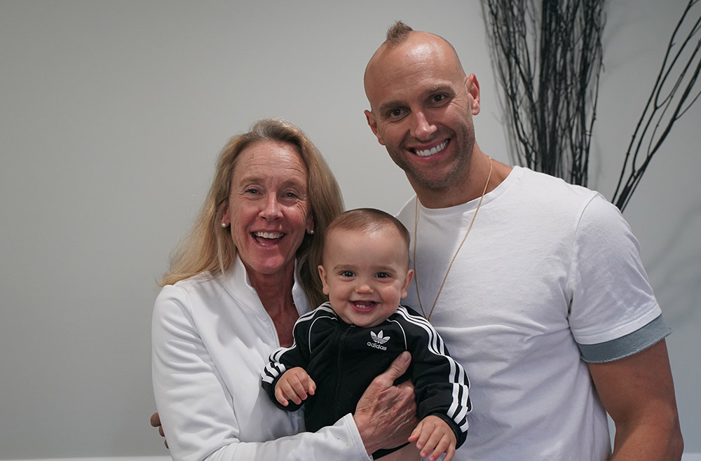 Mark Herzlich with his mother, Barb Herzlich, and son Boston Herzlich